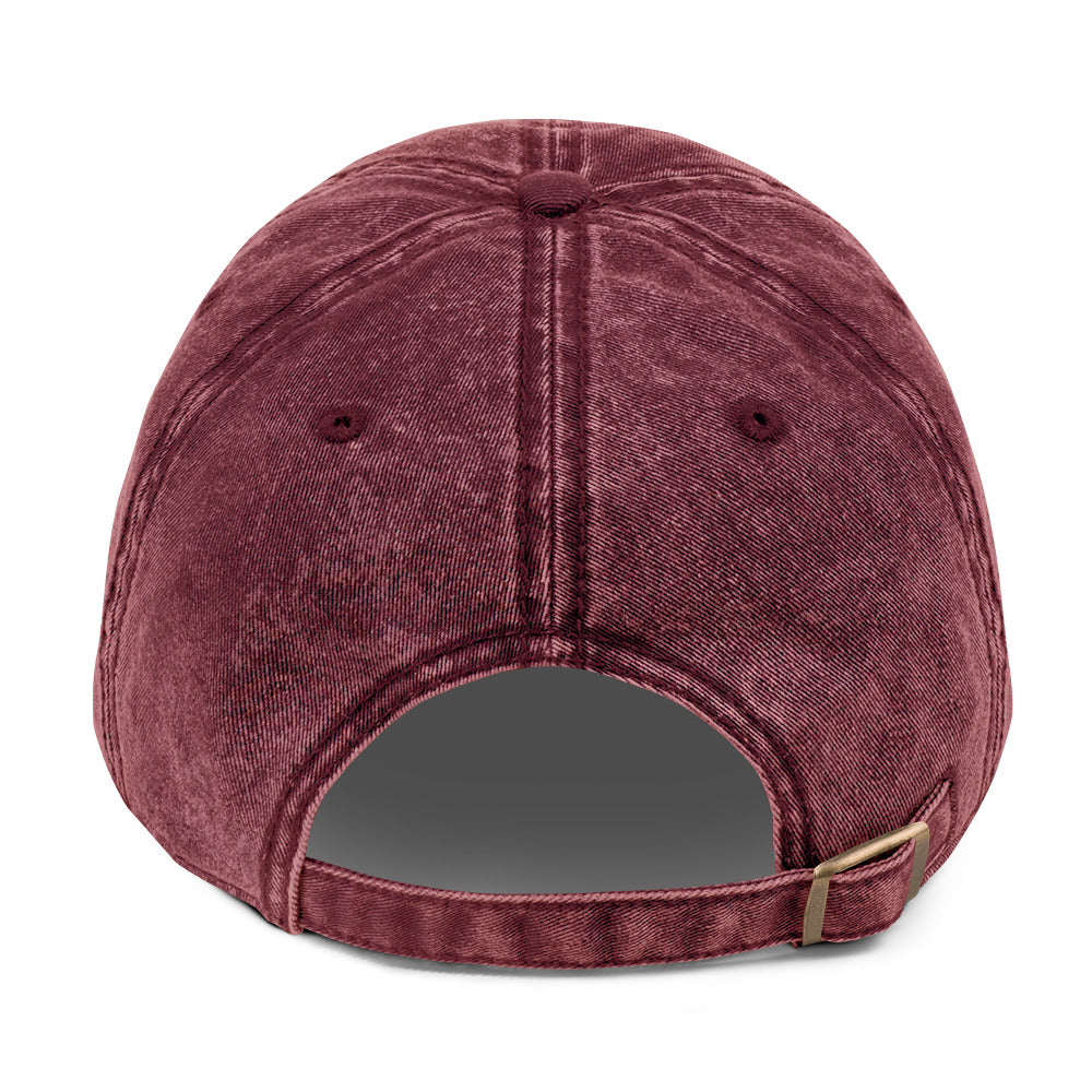 Back of the maroon vintage cap showing the adjustable antique-brass buckle
