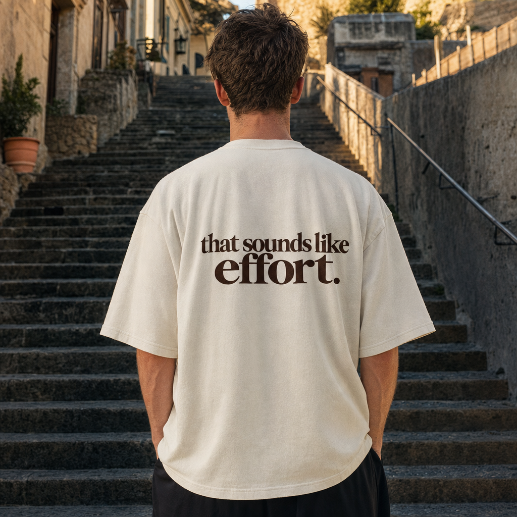 That Sounds Like Effort oversized tee, back print, at the foot of a long stairway