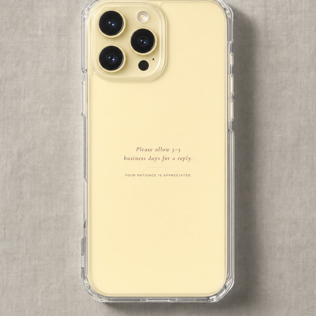 Clear iPhone case printed “Please allow 3-5 business days for a reply” in dark rose lettering